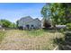 Expansive backyard featuring a deck, grass and a fence, offering ample space for outdoor activities at 5229 Nighthawk Pkwy, Brighton, CO 80601