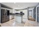 Beautiful kitchen features white cabinets, granite countertops, stainless steel appliances, and a center island at 5229 Nighthawk Pkwy, Brighton, CO 80601