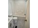 Full white bathroom with shower and tub combination and modern vanity at 311 Elm St, Lochbuie, CO 80603