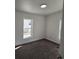 Bedroom with two windows providing natural light and soft carpeting at 311 Elm St, Lochbuie, CO 80603