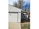 Exterior shot of a detached white garage with shed at 311 Elm St, Lochbuie, CO 80603