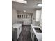 Updated kitchen with stainless steel appliances, ample counter space, and modern cabinetry at 311 Elm St, Lochbuie, CO 80603