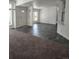 Spacious living room with sleek, modern flooring and natural light at 311 Elm St, Lochbuie, CO 80603