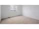 Neutral bedroom featuring a large window allowing for plenty of natural light at 6566 N Nepal St, Aurora, CO 80019