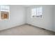 Bright, vacant bedroom featuring two windows that provide lots of natural light at 6566 N Nepal St, Aurora, CO 80019