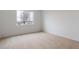 Neutral bedroom featuring a large window allowing for plenty of natural light at 6566 N Nepal St, Aurora, CO 80019