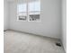 Neutral bedroom featuring two windows allowing for plenty of natural light at 6566 N Nepal St, Aurora, CO 80019