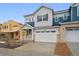 Charming new two-story home with attached two-car garage and inviting front porch at 6566 N Nepal St, Aurora, CO 80019