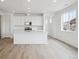 Modern kitchen featuring an island, stainless steel appliances, and lots of natural light at 6566 N Nepal St, Aurora, CO 80019