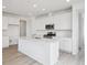 Modern kitchen featuring an island, stainless steel appliances, and lots of cabinet space at 6566 N Nepal St, Aurora, CO 80019