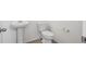 Simple powder room featuring a pedestal sink and standard toilet at 6566 N Nepal St, Aurora, CO 80019