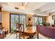 Dining room featuring a wooden table set and large windows with natural light at 7865 E Mississippi Ave # 304, Denver, CO 80247