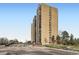 Contemporary apartment building with many windows and adjacent parking at 7865 E Mississippi Ave # 304, Denver, CO 80247