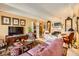 Cozy living room with vintage furniture, patterned rugs, and ample seating at 7865 E Mississippi Ave # 304, Denver, CO 80247