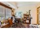 This office space has a desk, an area rug, and natural light from the window at 7865 E Mississippi Ave # 304, Denver, CO 80247