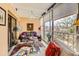 Relaxing sunroom with comfortable seating, a glass table, and large windows at 7865 E Mississippi Ave # 304, Denver, CO 80247