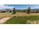 Large backyard featuring a stone perimeter and views of neighboring homes at 3367 New Haven Cir, Castle Rock, CO 80109
