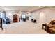Open finished basement with plush carpet, a massage chair, and a table set near a window at 3367 New Haven Cir, Castle Rock, CO 80109