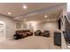 Finished basement with plush carpet, recessed lighting, and comfortable seating arrangement at 3367 New Haven Cir, Castle Rock, CO 80109
