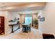 Finished basement with plush carpet, a table set, and a large potted plant near the window at 3367 New Haven Cir, Castle Rock, CO 80109