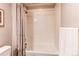 Clean and bright full bathtub and shower with a neutral shower curtain and towel at 3367 New Haven Cir, Castle Rock, CO 80109
