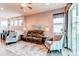 Comfortable living area with plush seating, hardwood floors, and ample natural light at 3367 New Haven Cir, Castle Rock, CO 80109