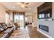 Cozy living room with a fireplace, plush seating, and sliding doors to outdoor area at 3367 New Haven Cir, Castle Rock, CO 80109