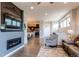 Open-concept living space featuring a fireplace and seamless flow to kitchen and dining areas at 3367 New Haven Cir, Castle Rock, CO 80109