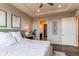 Bright main bedroom featuring a tray ceiling and ensuite bathroom with walk in closet at 3367 New Haven Cir, Castle Rock, CO 80109
