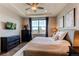 Spacious bedroom with stylish decor, a ceiling fan, and a large window for natural light and views at 3367 New Haven Cir, Castle Rock, CO 80109