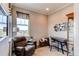 Comfortable home office with a plush armchair, desk, and a window offering natural light at 3367 New Haven Cir, Castle Rock, CO 80109