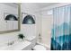 Clean bathroom with a bathtub, shower, and updated vanity at 8522 Wagner Dr, Westminster, CO 80031