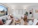 Bright living room with mid-century modern furniture and decor at 8522 Wagner Dr, Westminster, CO 80031