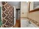 Bathroom featuring an open shower and view to the hallway at 1281 Myrtle St, Brighton, CO 80601