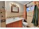 Bathroom with a neutral colored sink and a window for natural light at 1281 Myrtle St, Brighton, CO 80601