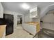 Functional kitchen with white cabinets, and tile floors at 1281 Myrtle St, Brighton, CO 80601