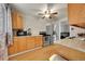 This bright kitchen includes stainless steel appliances, updated countertops, and wood cabinets at 1281 Myrtle St, Brighton, CO 80601