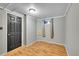 Small, minimally decorated room with light hardwood floors and gray walls at 1281 Myrtle St, Brighton, CO 80601