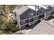 Aerial view of townhouses with gray roofs, balconies, garages, and landscaping showcasing design at 6730 W 84Th Cir # 96, Arvada, CO 80003