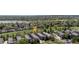 Stunning aerial view of townhomes near a golf course, with lake views and mature trees at 6730 W 84Th Cir # 96, Arvada, CO 80003