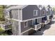Aerial view of townhouses featuring balconies and gray siding, highlighting architectural design at 6730 W 84Th Cir # 96, Arvada, CO 80003