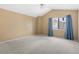 Well lit bedroom with vaulted ceilings and neutral colors at 6730 W 84Th Cir # 96, Arvada, CO 80003