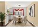 Cozy dining room featuring a round table and modern pendant lighting at 6730 W 84Th Cir # 96, Arvada, CO 80003
