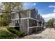 Row of townhouses in gray with balconies and garages showcasing modern design and landscaping at 6730 W 84Th Cir # 96, Arvada, CO 80003