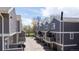 Townhouses with gray siding and balconies, showcasing a well-maintained residential area at 6730 W 84Th Cir # 96, Arvada, CO 80003