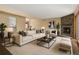 Bright living room with stylish fireplace and comfortable seating arrangement at 6730 W 84Th Cir # 96, Arvada, CO 80003