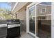Outdoor patio features sleek grill, siding, and sliding doors at 6730 W 84Th Cir # 96, Arvada, CO 80003