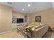 Basement living room showcasing oversized sectional, rug, shelving, and recessed lighting at 7975 S Gaylord Way, Centennial, CO 80122