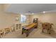 Spacious basement featuring carpet, shelving, windows and fun games at 7975 S Gaylord Way, Centennial, CO 80122