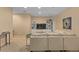 Basement living room area with neutral walls, carpet flooring, an oversized sectional, and shelving at 7975 S Gaylord Way, Centennial, CO 80122